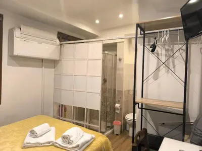 Letto o letti in una camera di Camera in centro a pochi passi dalla stazione