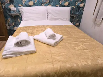 Letto o letti in una camera di Camera in centro a pochi passi dalla stazione