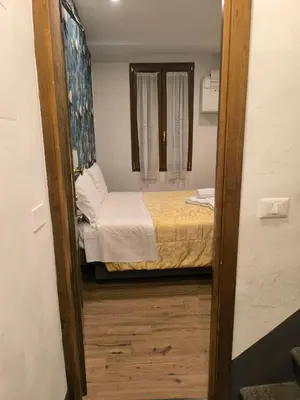 Letto o letti in una camera di Camera in centro a pochi passi dalla stazione