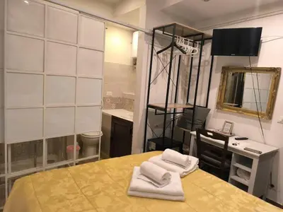 Letto o letti in una camera di Camera in centro a pochi passi dalla stazione