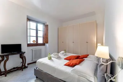 Letto o letti in una camera di UNYCA - Uffizi Museum Apartment in Florence