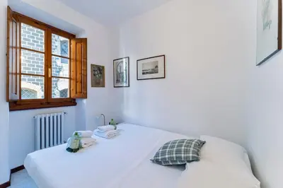 Letto o letti in una camera di UNYCA - Uffizi Museum Apartment in Florence