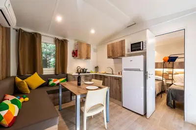 Cucina o angolo cottura di Camping Village Il Poggetto - Maeva