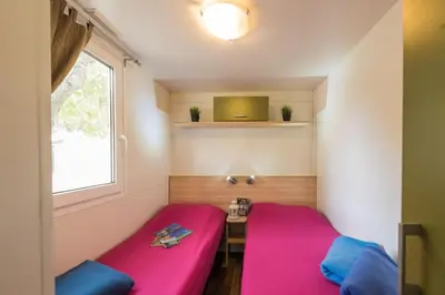 Letto o letti in una camera di Camping Village Il Poggetto - Maeva