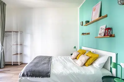 Letto o letti in una camera di New Happiness Studio Tram 150m
