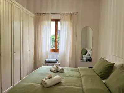 Letto o letti in una camera di La corte di Rolando - Delizioso appartamento a Fiesole