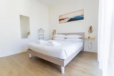 Letto o letti in una camera di Bright Apartment 2 in Guido monaco