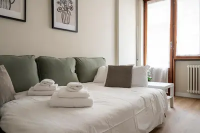 Letto o letti in una camera di Jacopino Urban Nest