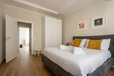 Letto o letti in una camera di Jacopino Urban Nest