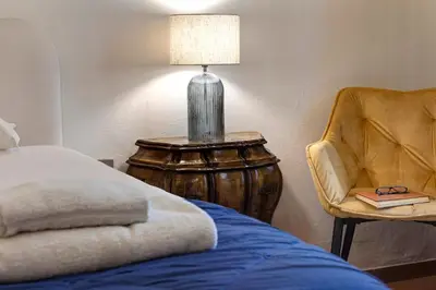 Letto o letti in una camera di Pergola Apartment by Mamo Florence