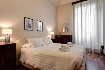 Letto o letti in una camera di Pergola Apartment by Mamo Florence