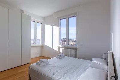 Letto o letti in una camera di GuestHost - Santa Maria Novella Charming Apartment