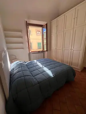 Letto o letti in una camera di Il nido sul Duomo
