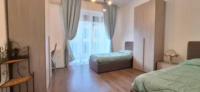 Letto o letti in una camera di Casa Puccini