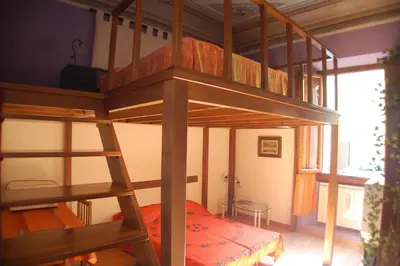 Letto o letti in una camera di B&B Porta San Frediano