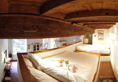 Letto o letti in una camera di Il Loft di Cinzia&Andrea Family home in HeartOfArt