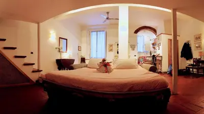 Letto o letti in una camera di Il Loft di Cinzia&Andrea Family home in HeartOfArt