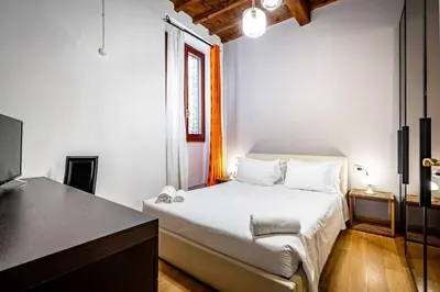 Letto o letti in una camera di YD San Niccolo riverside apartment