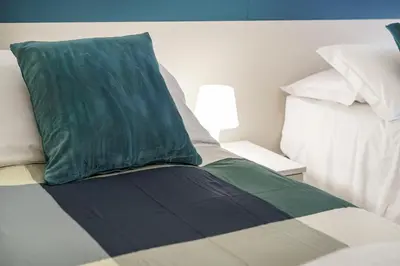 Letto o letti in una camera di Petrarca Home, Firenze