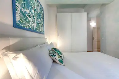 Letto o letti in una camera di San Lorenzo Apartment by Mamo Florence