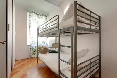Letto o letti in una camera di San Lorenzo Apartment by Mamo Florence