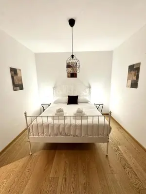 Letto o letti in una camera di Close to the historic center with free parking