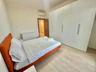 Letto o letti in una camera di Comfortamble house a pochi passi dalla tramvia
