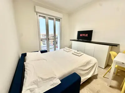 Letto o letti in una camera di Comfortamble house a pochi passi dalla tramvia