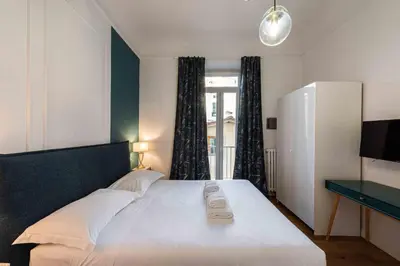 Letto o letti in una camera di Lotus San Frediano by MMega
