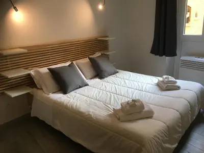 Letto o letti in una camera di Nonna Lina Rooms
