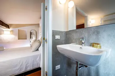 Letto o letti in una camera di YD Four suites Ognissanti
