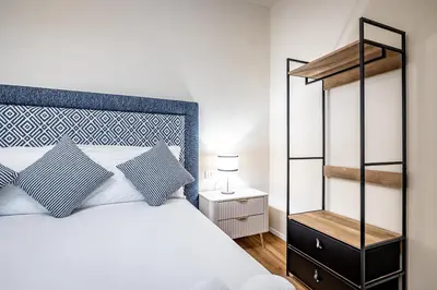 Letto o letti in una camera di YD Four suites Ognissanti
