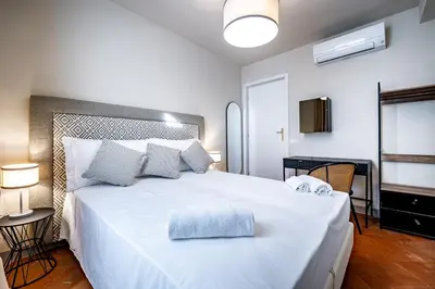 Letto o letti in una camera di YD Four suites Ognissanti