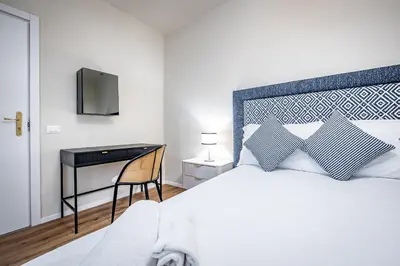 Letto o letti in una camera di YD Four suites Ognissanti