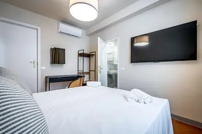 Letto o letti in una camera di YD Four suites Ognissanti