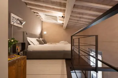 Letto o letti in una camera di San Lorenzo Mezzanine