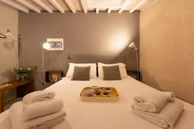 Letto o letti in una camera di San Lorenzo Mezzanine