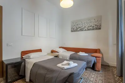 Letto o letti in una camera di Delux Via Faenza