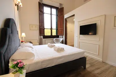Letto o letti in una camera di Prestige Milton Apartment Florence