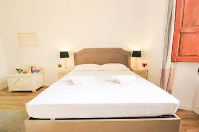 Letto o letti in una camera di Signature Milton Green Apartment Florence