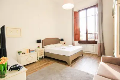 Letto o letti in una camera di Signature Milton Green Apartment Florence