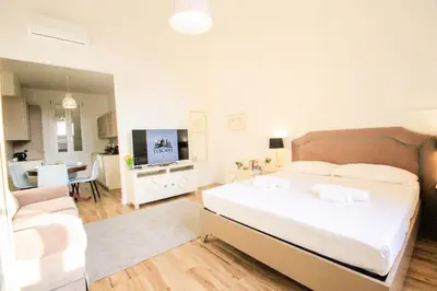 Letto o letti in una camera di Signature Milton Green Apartment Florence