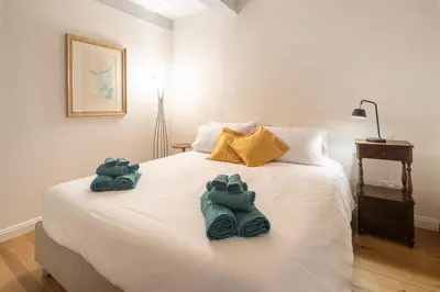 Letto o letti in una camera di Suite storica Santo Spirito - 5 min Ponte Vecchio