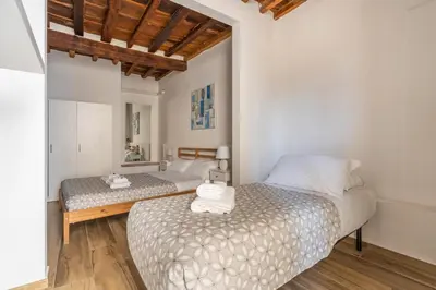Letto o letti in una camera di Appartamento Palazzuolo By San Firenze Collection