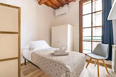 Letto o letti in una camera di Appartamento Palazzuolo By San Firenze Collection