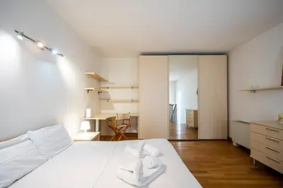 Letto o letti in una camera di Elegant Loft a due passi dal Centro by Hôtea