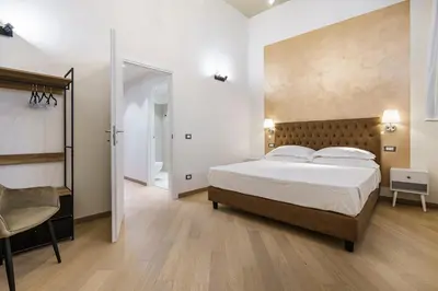 Letto o letti in una camera di Alinari Boutique Adapartment Collection