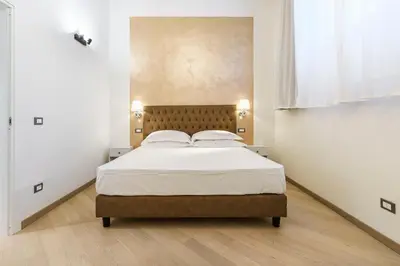 Letto o letti in una camera di Alinari Boutique Adapartment Collection