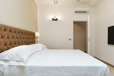 Letto o letti in una camera di Alinari Boutique Adapartment Collection