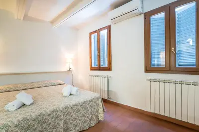 Letto o letti in una camera di Cozy Central Apartment